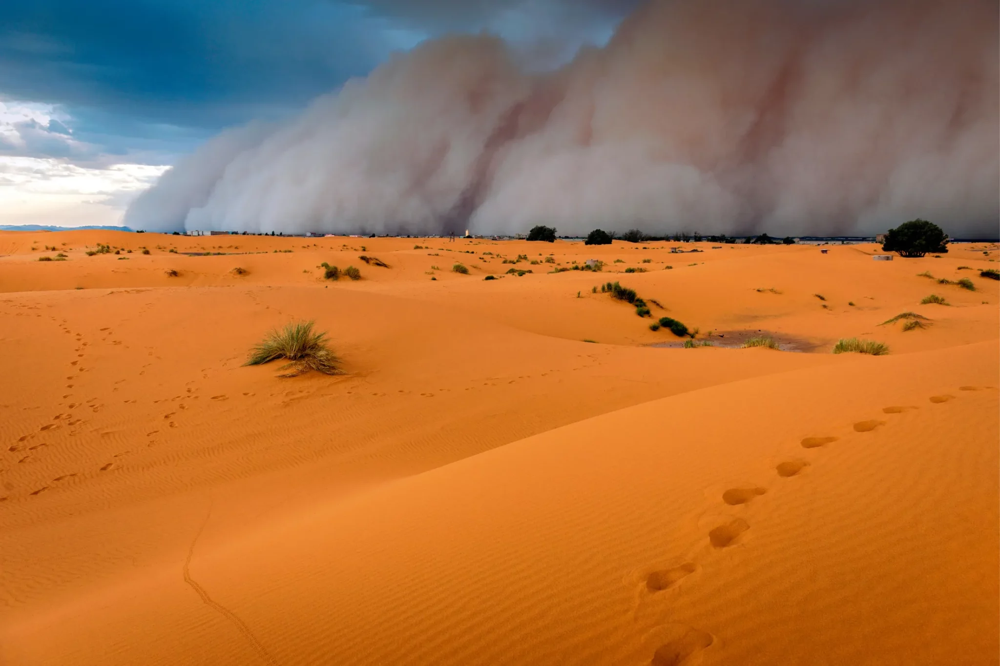 Sandstorm Approaching Merzouga Settlement, in Erg Chebbi Morocco Desert