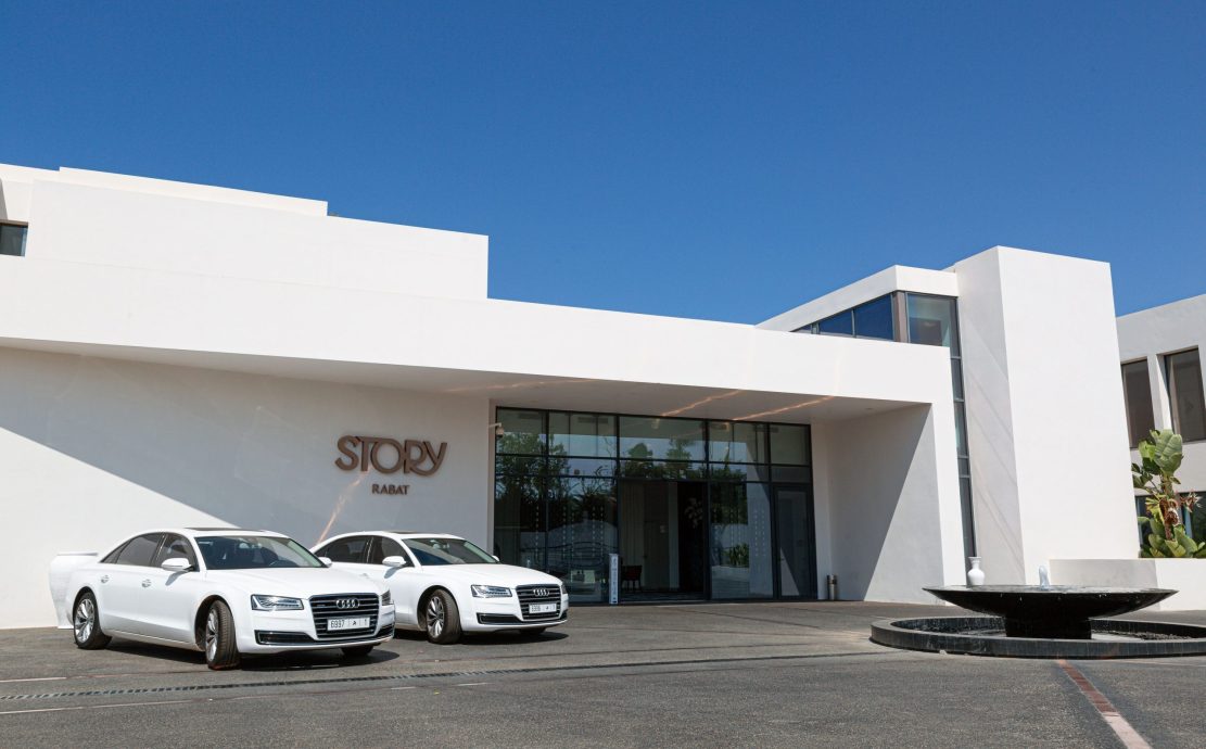 rabat story hotel entrance with two white AUDI A8 cars parked outside the front door