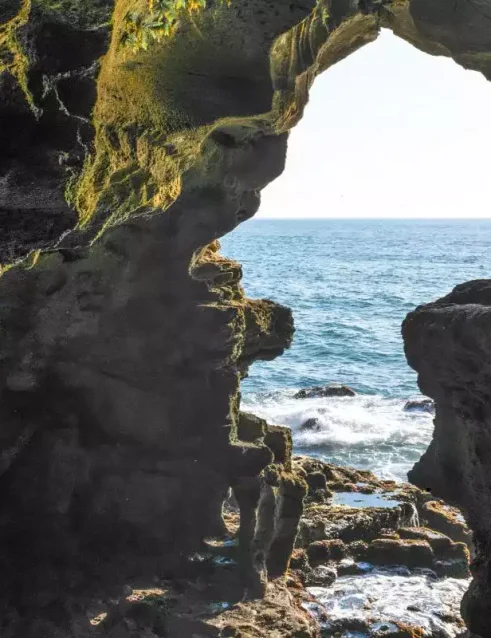 Caves of Hercules in Tangier with a natural rock opening framing the Atlantic Ocean.